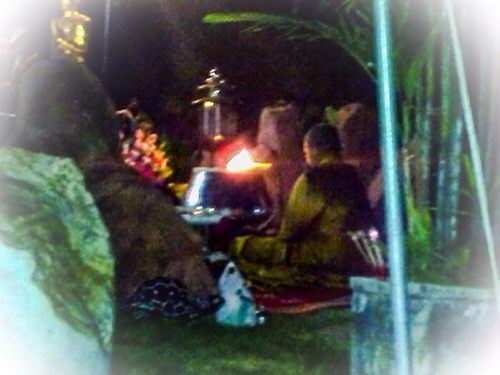 Kroo Ba Krissana Intawano performing the blessing of amulets in a sacred Cave.