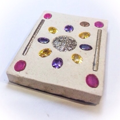 Precious gems and solid silver yantra foil Takrut spells, R.N. bedded within the rear face of the Butterfly King amulet