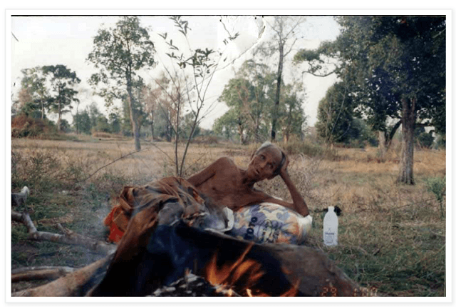 Luang Phor Suang in one of the fields he would sleep in, burning his possessions.